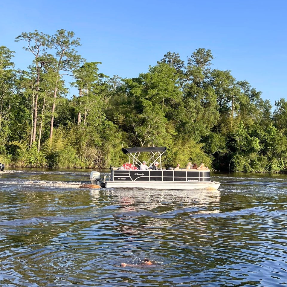 Family Riding in a Pontoon Boat.